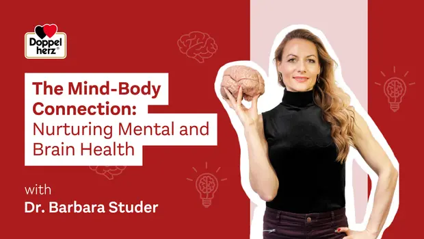 A woman with long hair holds a brain model in one hand, promoting the theme "The Mind-Body Connection: Nurturing Mental and Brain Health." The text features her name, Dr. Barbara Studer, and a logo for Doppel herz, set against a red background with graphic lightbulbs and brain illustrations.
