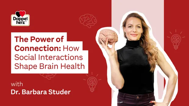 A woman holds a model of a brain and stands against a red background. The text above her reads "The Power of Connection: How Social Interactions Shape Brain Health" and "with Dr. Barbara Studer." The logo "Doppelherz" is visible in the top left corner.