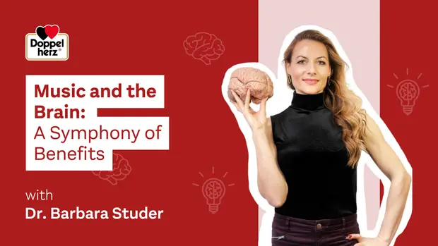 A woman holds a brain model while standing against a red background. The text on the image highlights the topic "Music and the Brain: A Symphony of Benefits," featuring Dr. Barbara Studer. Light bulb icons in the background suggest ideas and insights related to the topic.